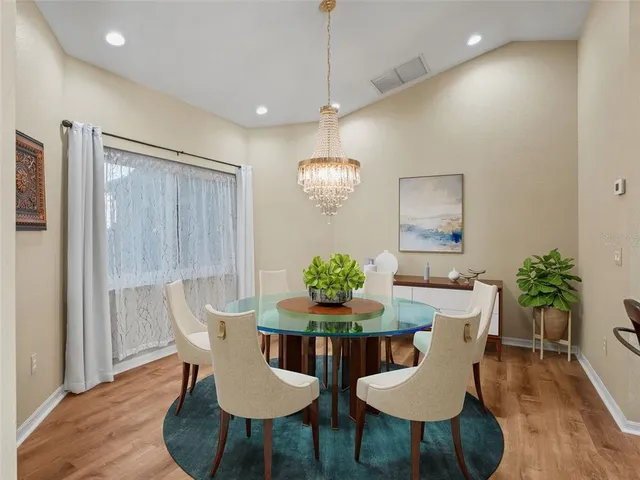 a large kitchen with stainless steel appliances granite countertop a stove and a sink