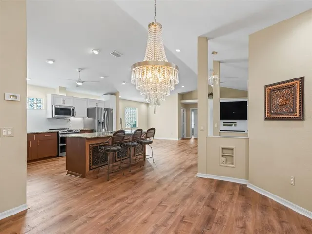 a kitchen with a sink stove and microwave