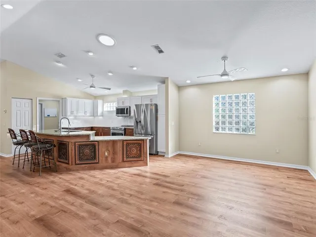 a bedroom with a bed couch and window