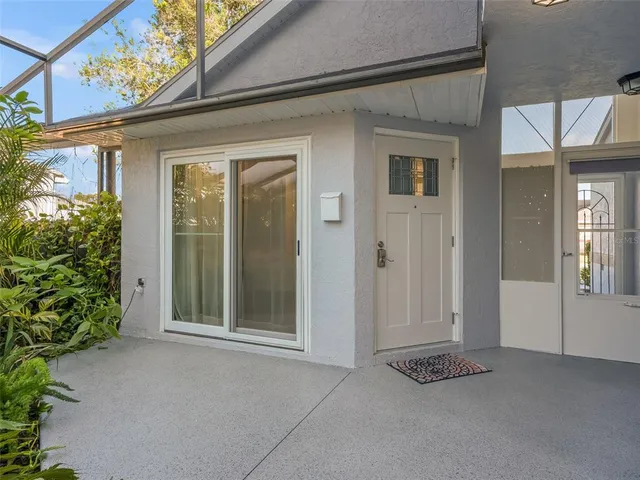 a swimming pool with outdoor seating and yard