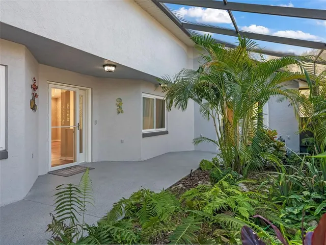 a view of a house with a flower plants