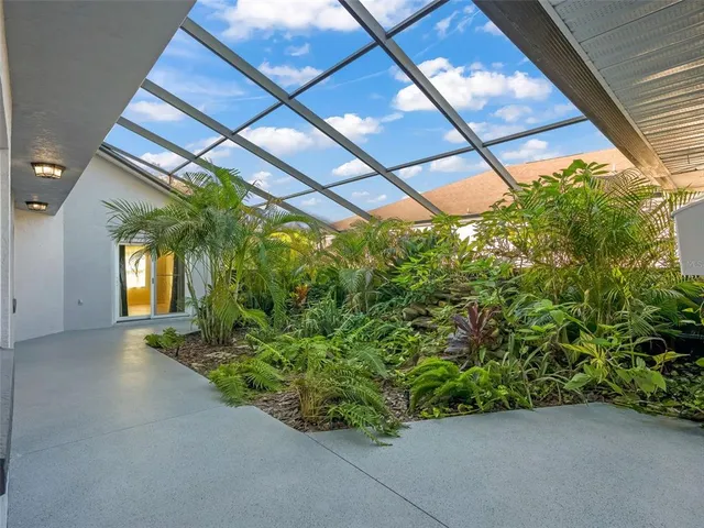 a backyard of a house with lots of green space