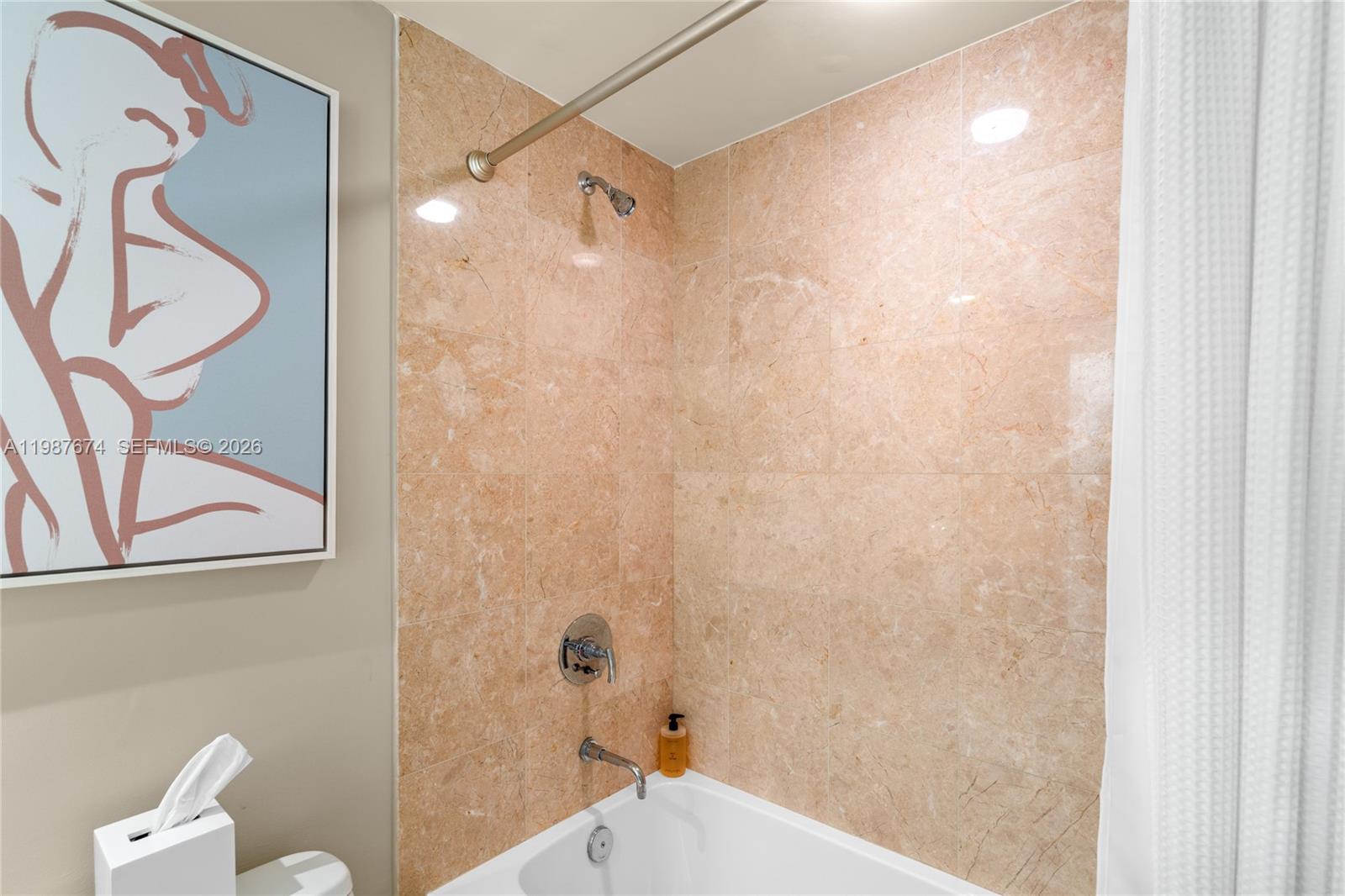 901 Brickell Key Boulevard, Unit 2804 Miami, FL 33131 - Photo 32 of 91 a bathroom with a shower and a toilet