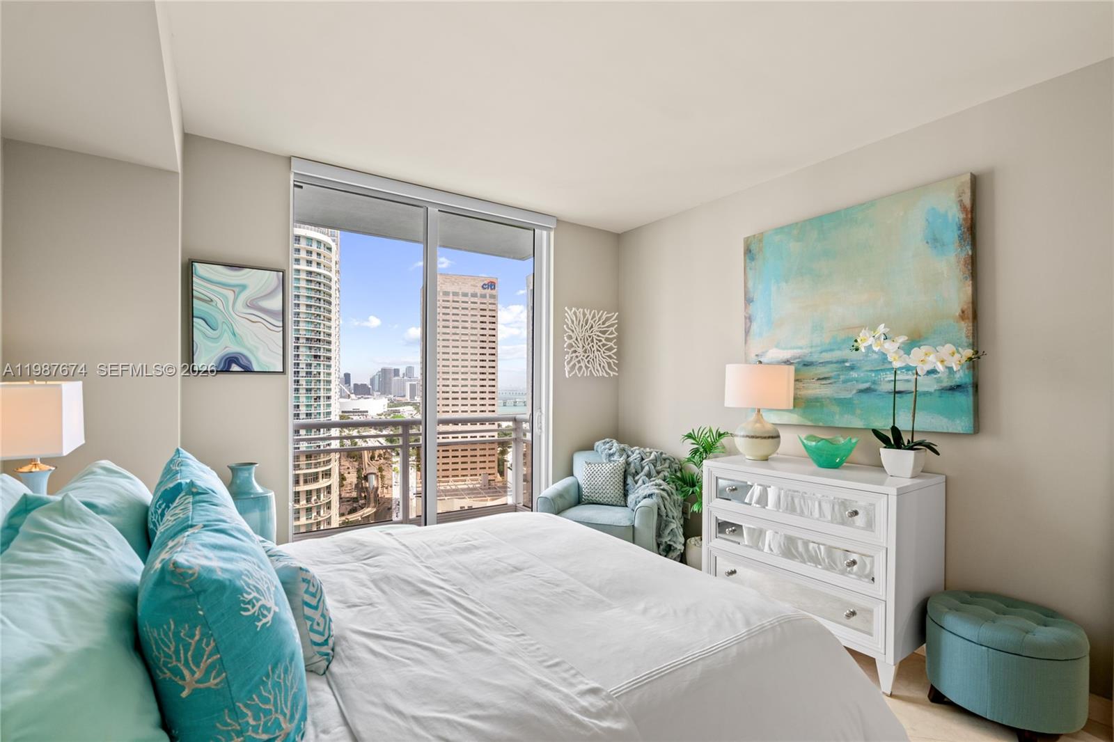 901 Brickell Key Boulevard, Unit 2804 Miami, FL 33131 - Photo 34 of 91 a bedroom with a bed and a large window