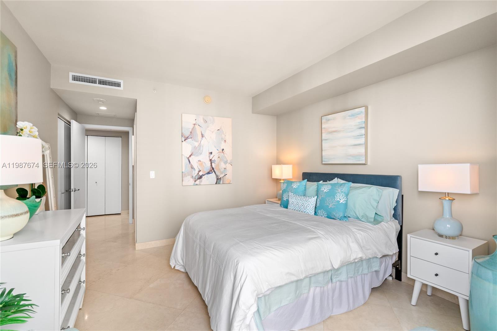 901 Brickell Key Boulevard, Unit 2804 Miami, FL 33131 - Photo 38 of 91 a bedroom with a bed and a couch