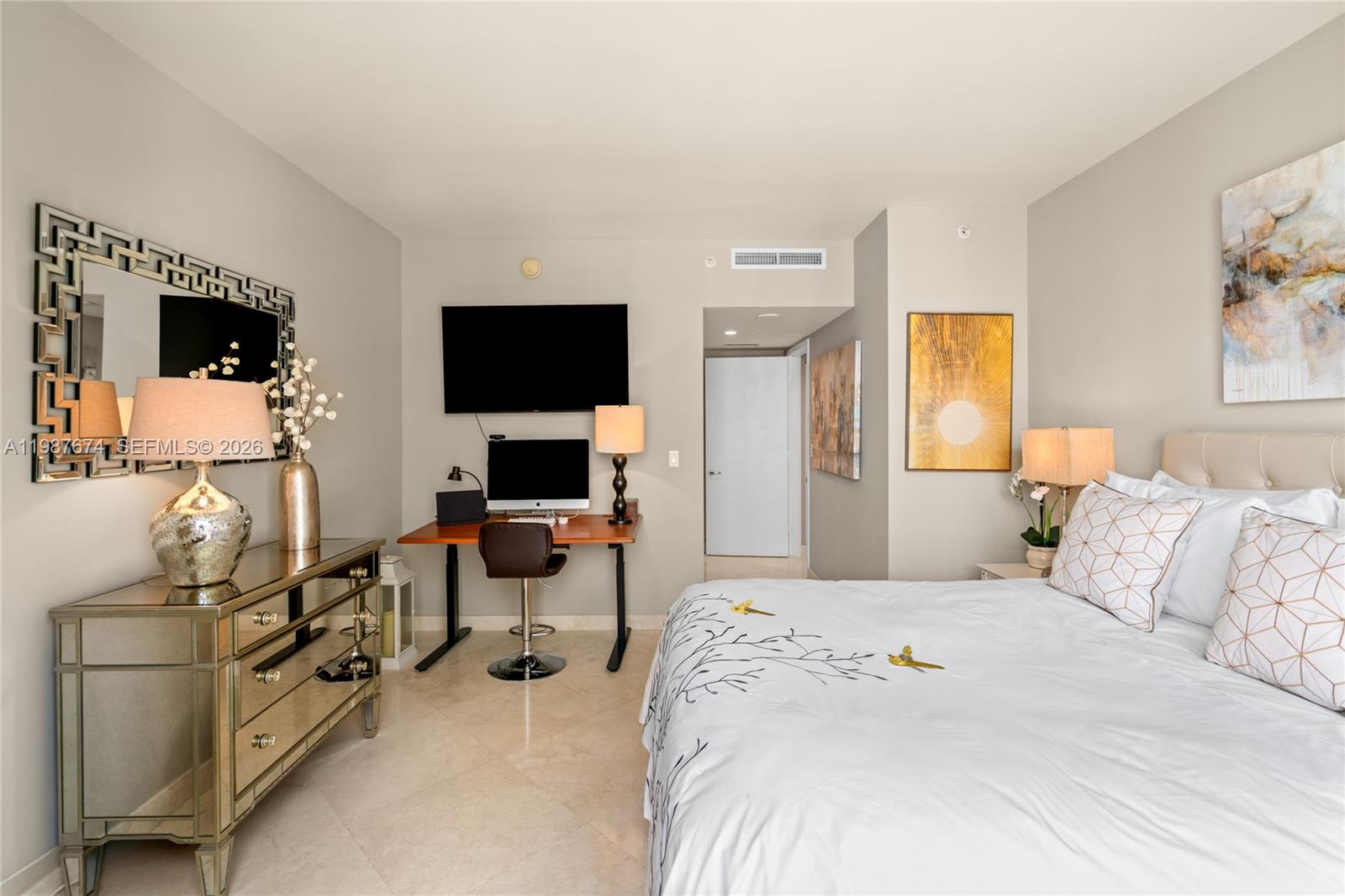 901 Brickell Key Boulevard, Unit 2804 Miami, FL 33131 - Photo 48 of 91 a bedroom with a bed and a flat screen tv