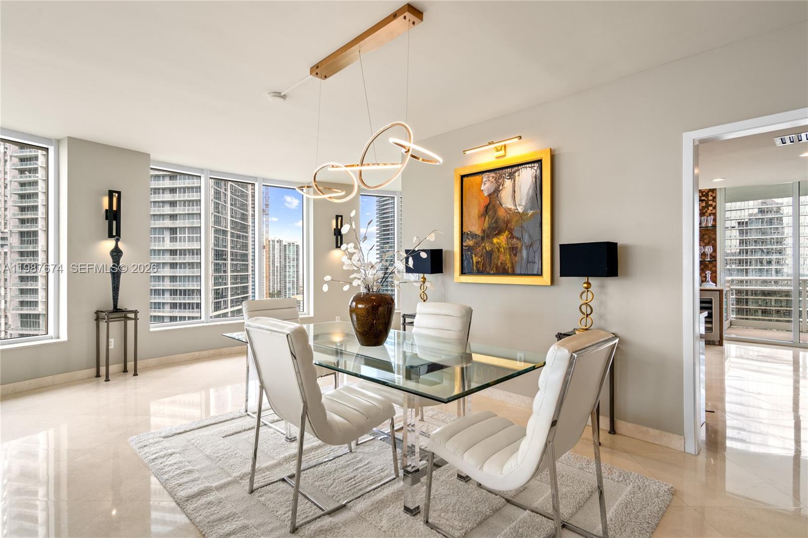 901 Brickell Key Boulevard, Unit 2804 Miami, FL 33131 - Photo 5 of 91 a view of a dining room with furniture and windows