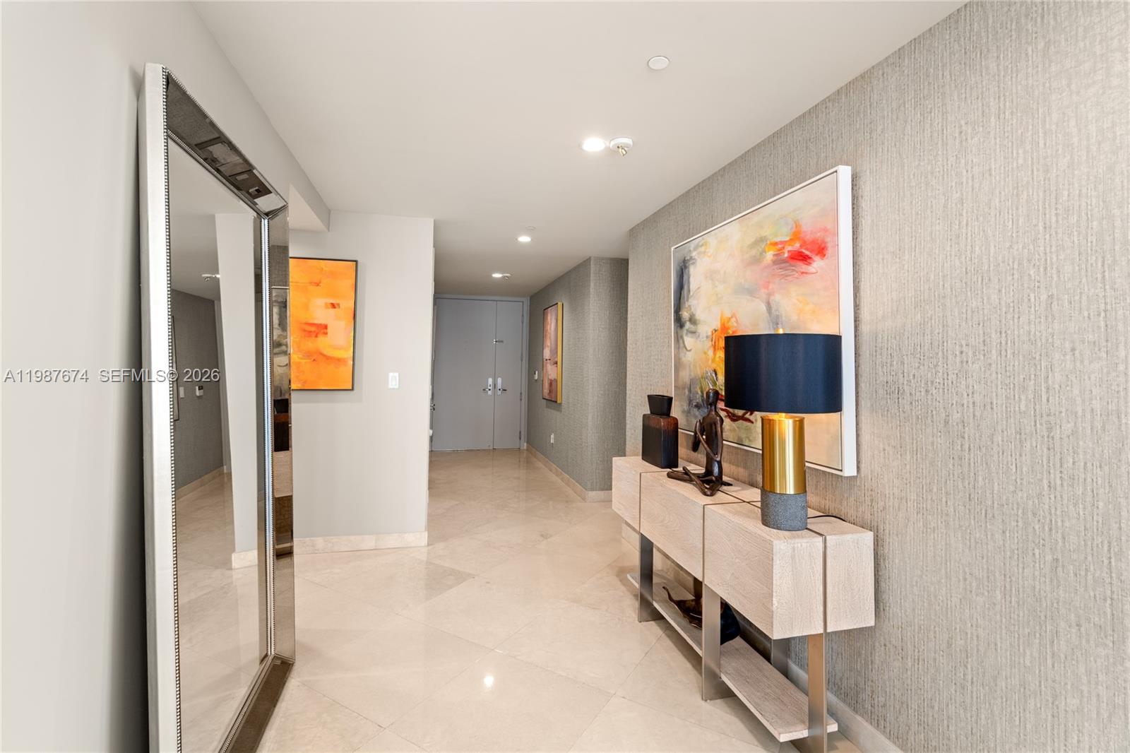 901 Brickell Key Boulevard, Unit 2804 Miami, FL 33131 - Photo 64 of 91 a view of living room with furniture and flat screen tv