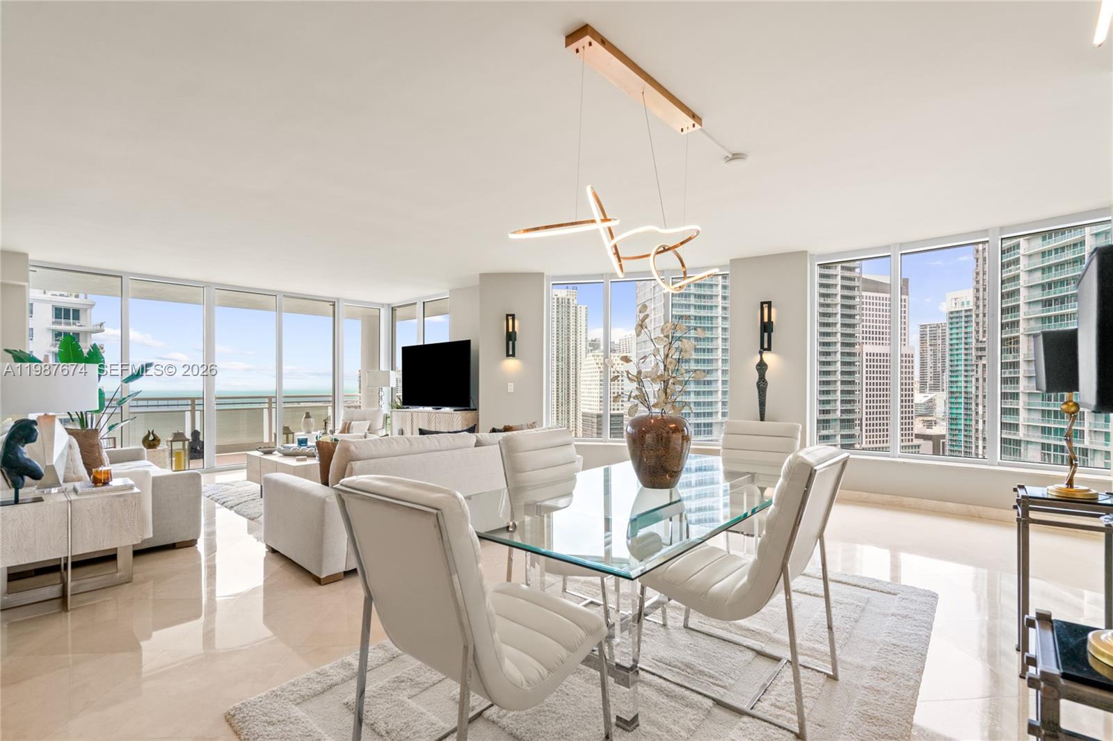 901 Brickell Key Boulevard, Unit 2804 Miami, FL 33131 - Photo 7 of 91 a view of a dining room with furniture window and outside view
