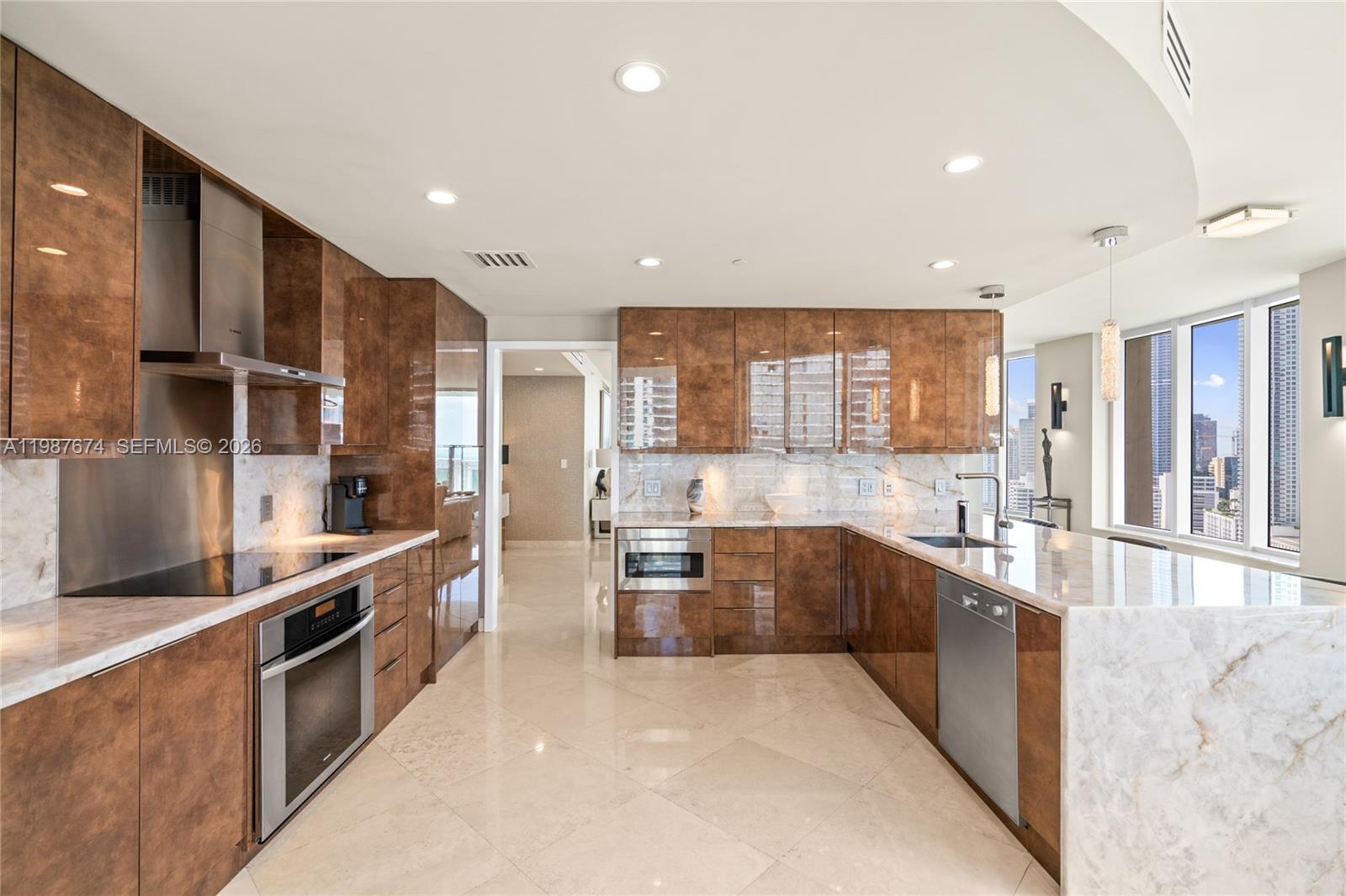 901 Brickell Key Boulevard, Unit 2804 Miami, FL 33131 - Photo 88 of 91 a large kitchen with stainless steel appliances lots of counter top space