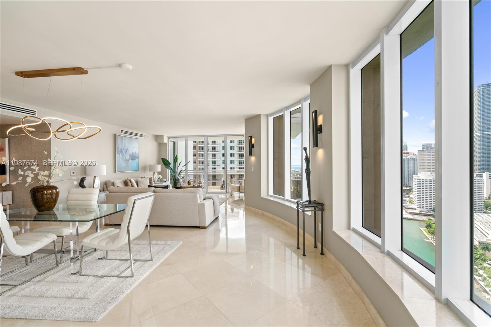 901 Brickell Key Boulevard, Unit 2804 Miami, FL 33131 - Photo 89 of 91 a living room with furniture and a large window