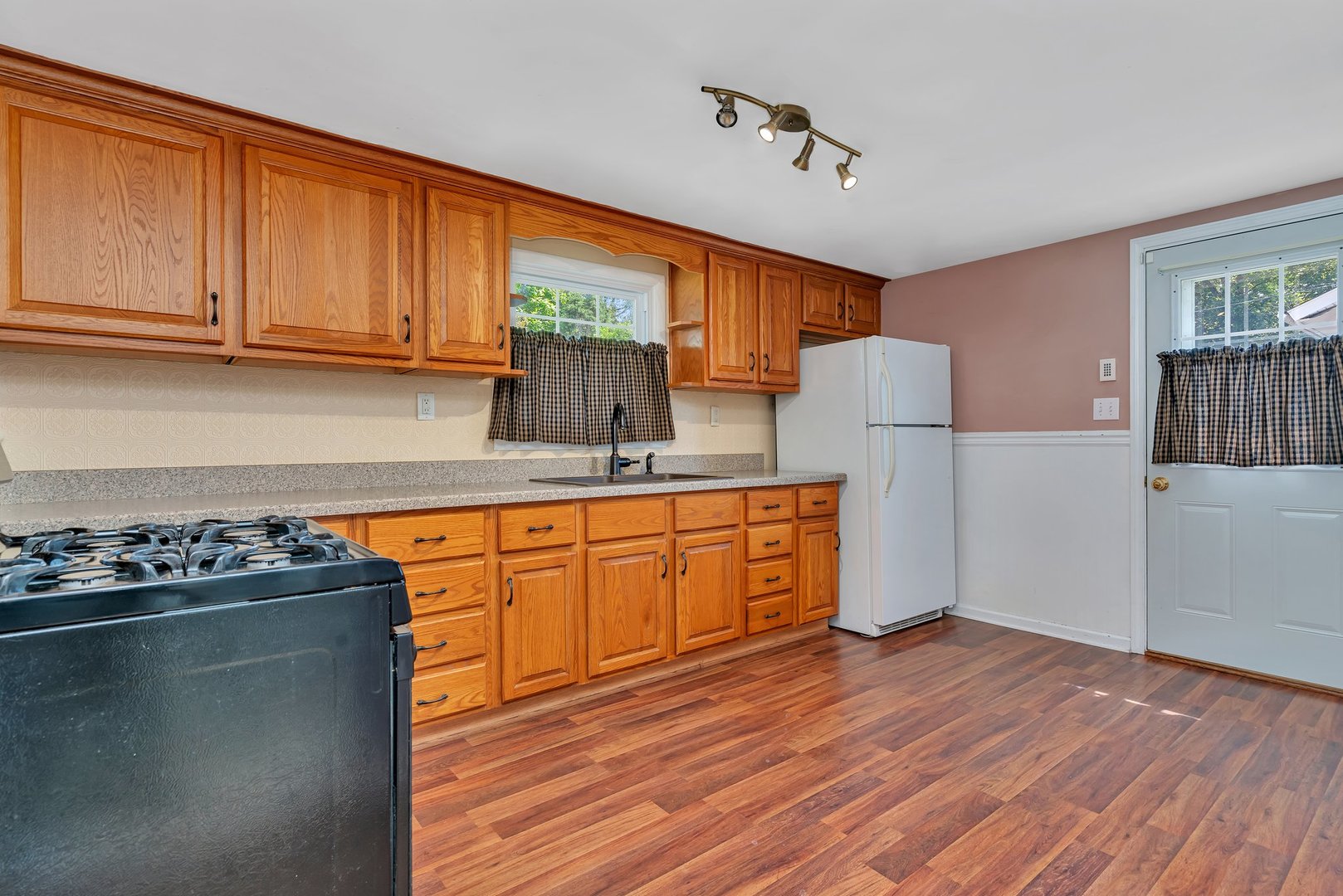 307 Bruce Road Lockport, IL 60441 - Photo 21 of 23 a kitchen with stainless steel appliances granite countertop a refrigerator a stove top oven a sink with wooden floors and cabinets