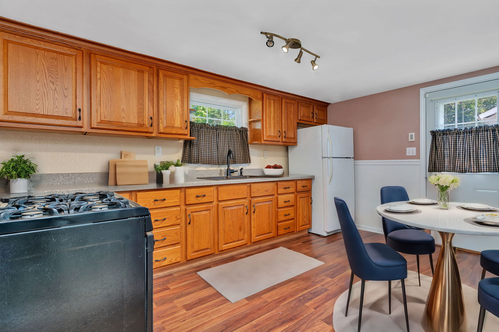 307 Bruce Road Lockport, IL 60441 - Photo 4 of 23 a kitchen with stainless steel appliances granite countertop a stove a refrigerator a sink dishwasher a dining table and chairs with wooden floor