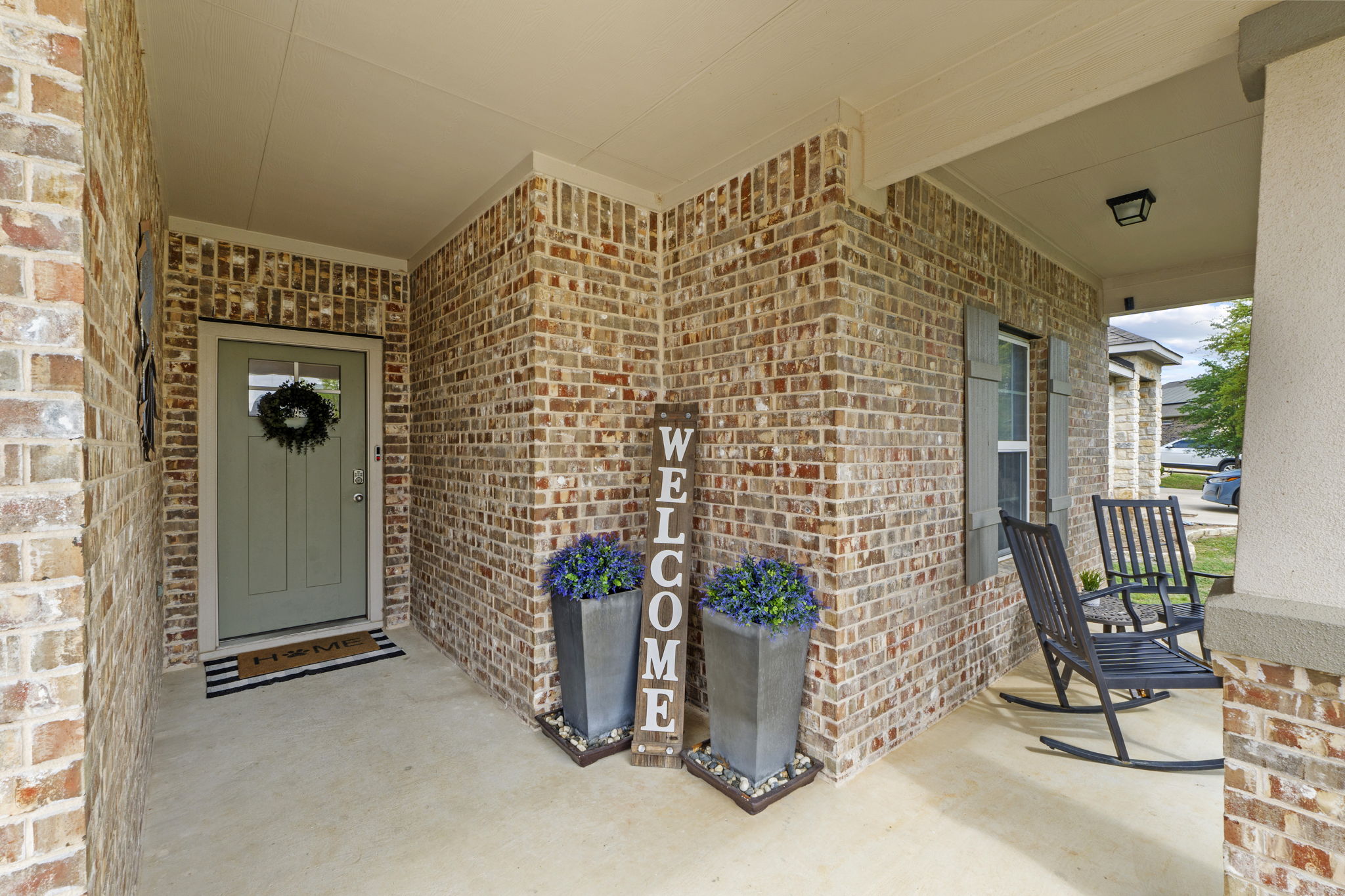 2417 Bridges Ranch Road Georgetown, TX 78628 - Photo 2 of 36 View of exterior entry featuring a porch and brick siding