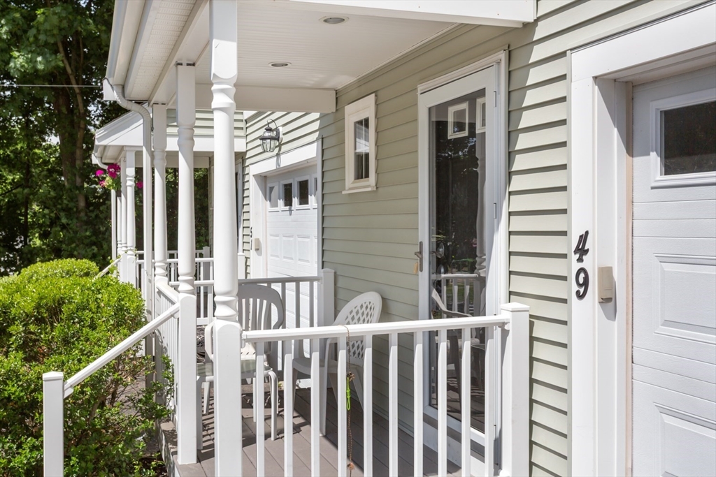 49 Beaver Street, Unit 49 Franklin, MA 02038 - Photo 34 of 46 a view of a house with a porch