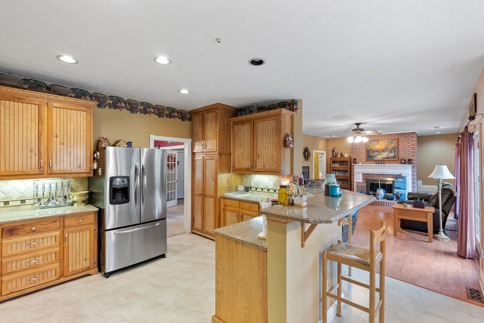 7336 Chowning Road Springfield, TN 37172 - Photo 17 of 45 a kitchen with stainless steel appliances granite countertop a refrigerator a stove a sink a dining table and chairs