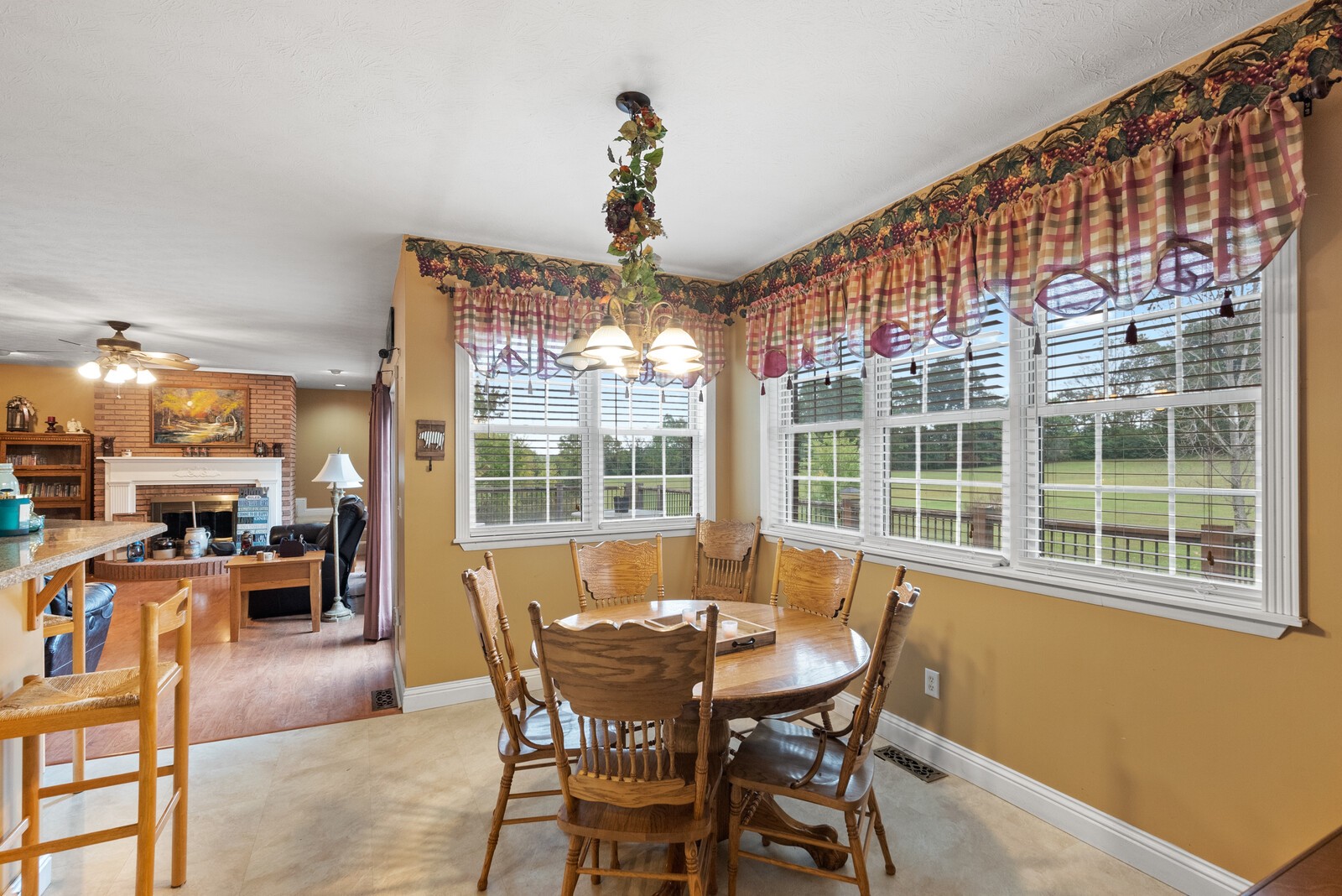 7336 Chowning Road Springfield, TN 37172 - Photo 18 of 45 a view of a dining room with furniture large windows and wooden floor