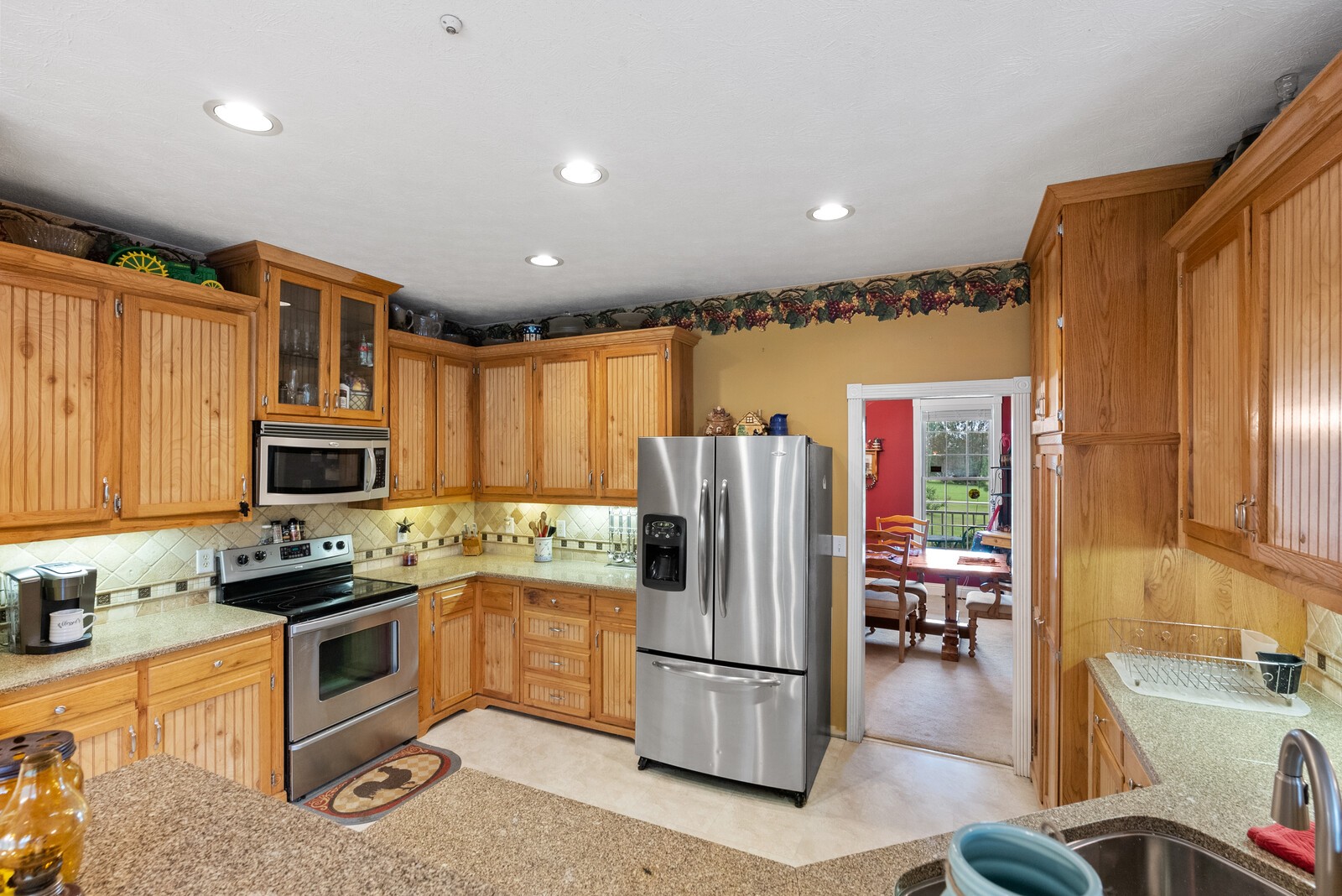 7336 Chowning Road Springfield, TN 37172 - Photo 19 of 45 a kitchen with stainless steel appliances granite countertop a refrigerator a stove top oven a sink and dishwasher