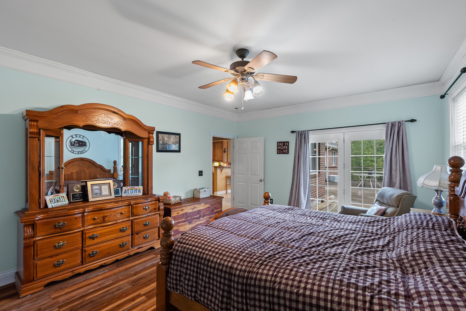 7336 Chowning Road Springfield, TN 37172 - Photo 22 of 45 a bedroom with a bed and a large dresser with wooden floor