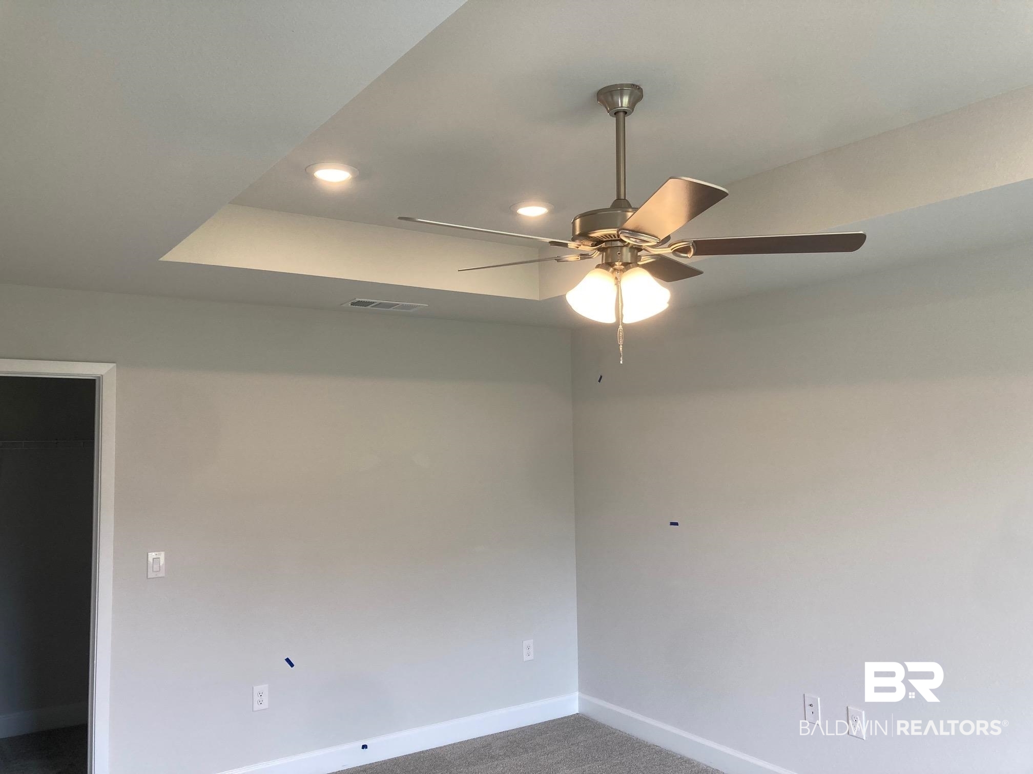 705 Mayflower Drive Foley, AL 36535 - Photo 9 of 19 Empty room with carpet flooring, baseboards, visible vents, ceiling fan, and recessed lighting