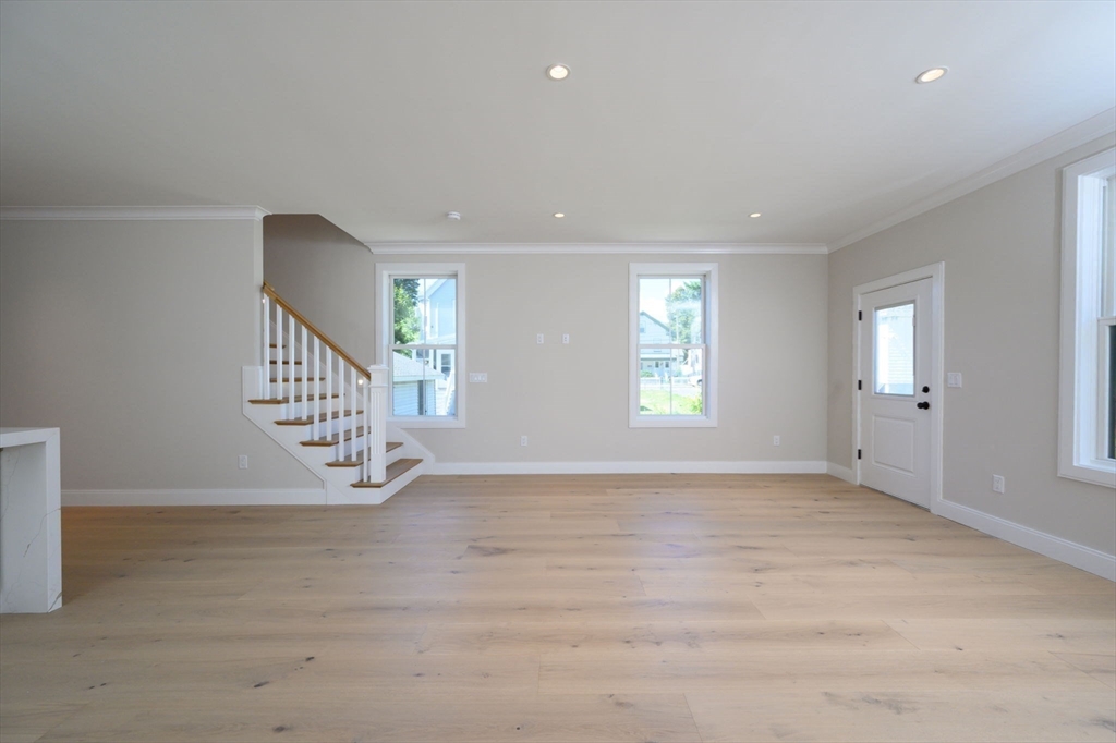 43 Chickatawbut Street, Unit 1 Boston, MA 02122 - Photo 12 of 42 wooden floor in an empty room with a window