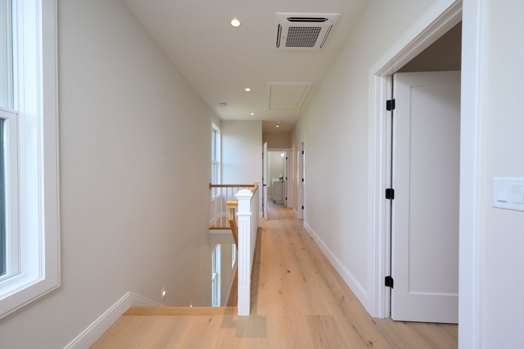 43 Chickatawbut Street, Unit 1 Boston, MA 02122 - Photo 16 of 42 a view of a hallway with a white walls