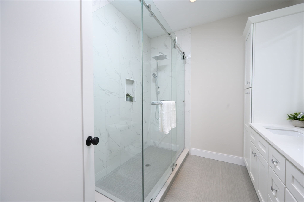 43 Chickatawbut Street, Unit 1 Boston, MA 02122 - Photo 22 of 42 a bathroom with a shower and a sink