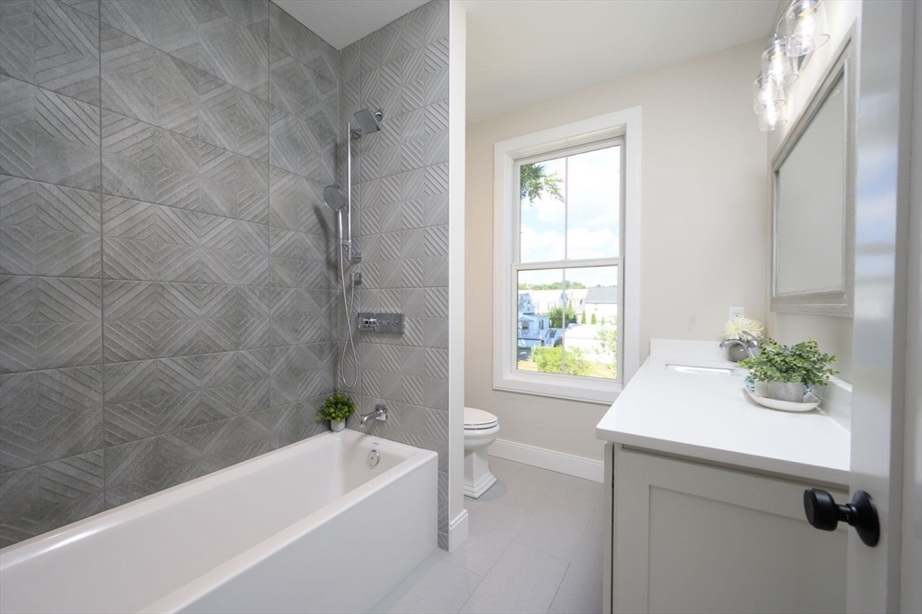 43 Chickatawbut Street, Unit 1 Boston, MA 02122 - Photo 35 of 42 a bathroom with a sink a bathtub and window