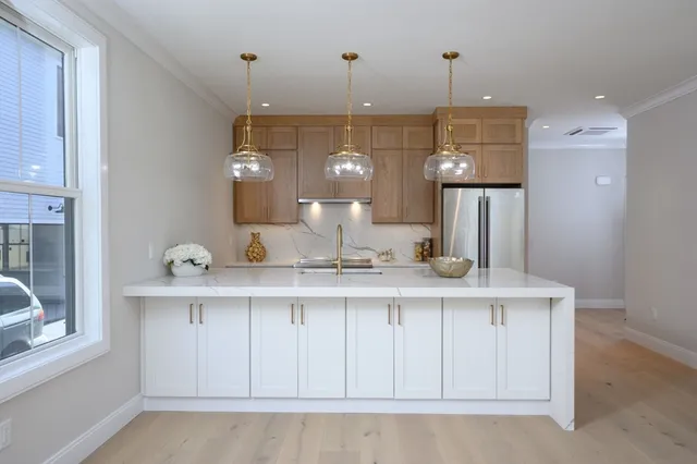 a kitchen with a sink and a stove