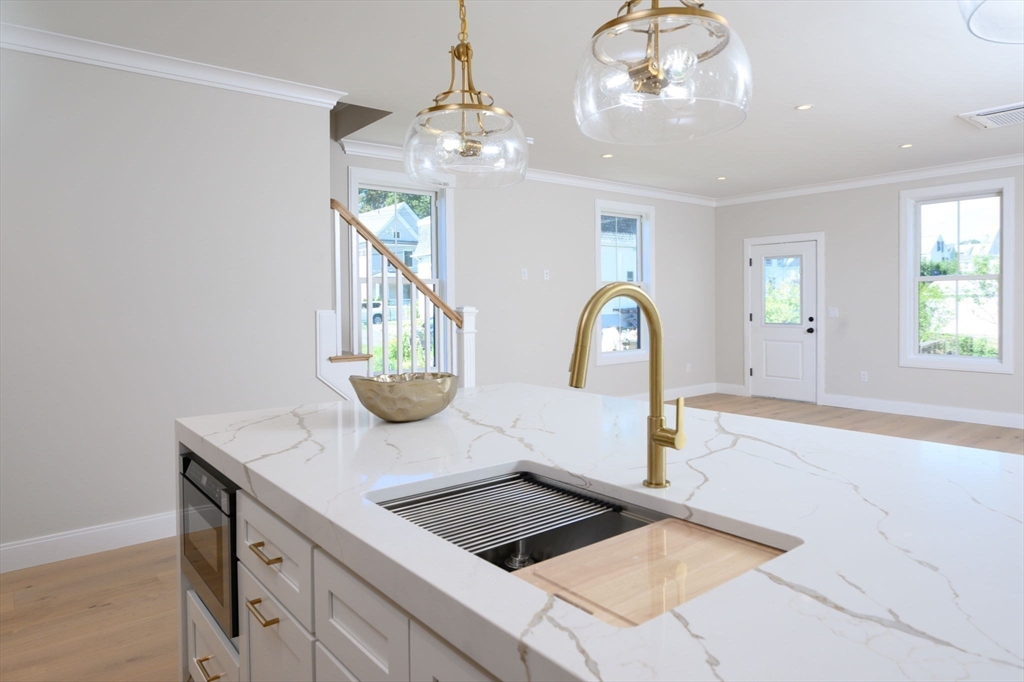 43 Chickatawbut Street, Unit 1 Boston, MA 02122 - Photo 8 of 42 a kitchen with a sink a counter space and a window