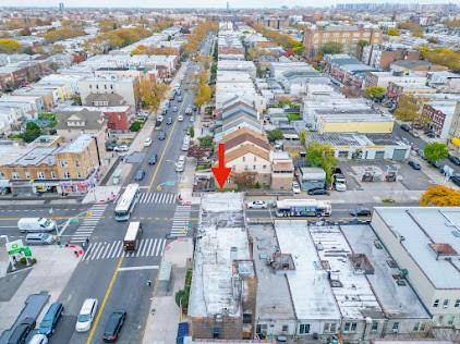 7502 18th Avenue Brooklyn, NY 11214 - Photo 11 of 12 an aerial view of residential houses with outdoor space