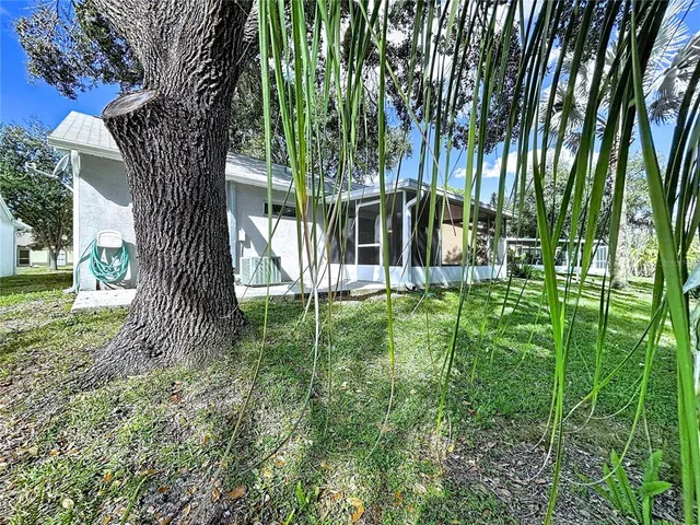 a kitchen with a sink cabinets and window