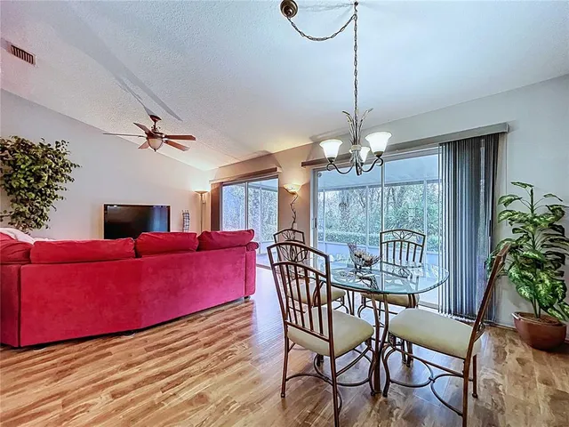 a bathroom with a granite countertop sink toilet and mirror