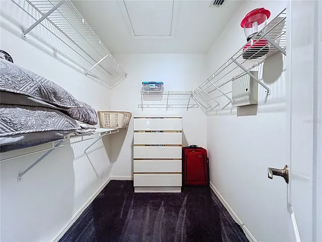 a view of parking garage with cars and other equipment