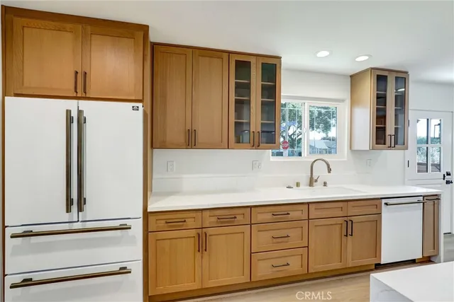 a kitchen with a sink and a refrigerator