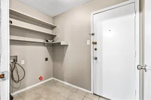 a view of walk in closet with clothes