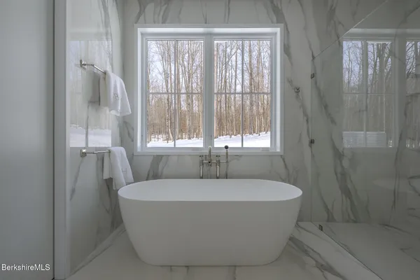 a view of a room with workspace and a window