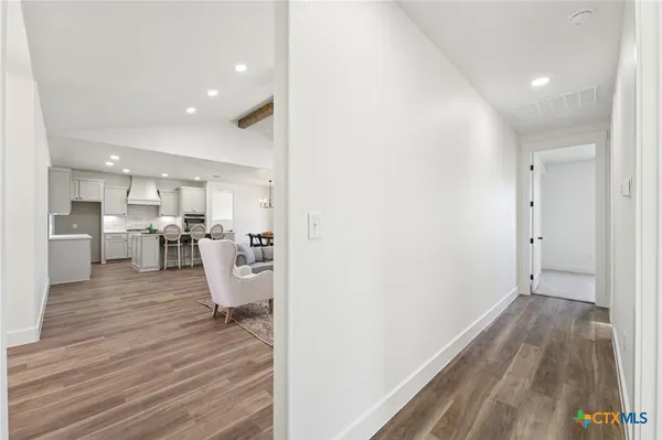 a view of kitchen with wooden floor
