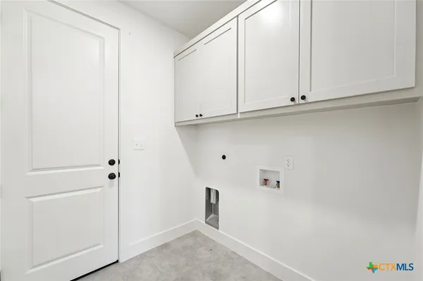 a view of kitchen with baby crib