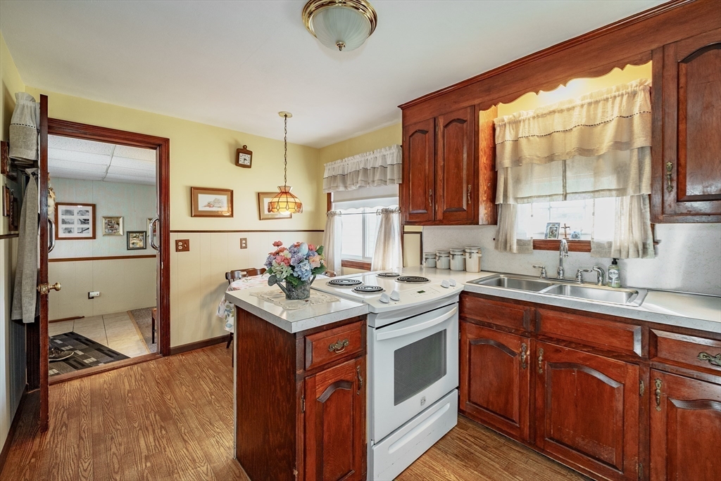 120 Welland Road Springfield, MA 01151 - Photo 13 of 36 a kitchen with a sink stove and cabinets