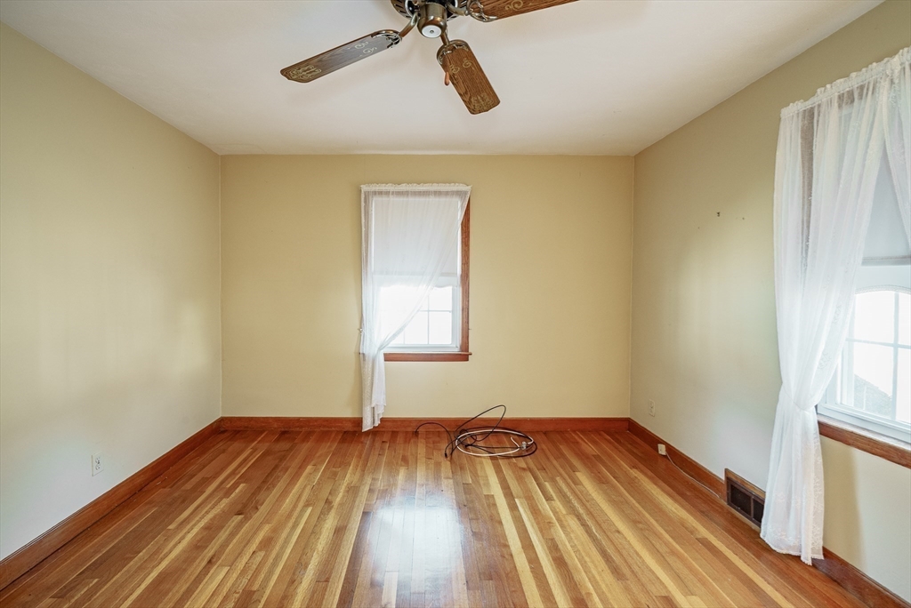 120 Welland Road Springfield, MA 01151 - Photo 20 of 36 wooden floor in an empty room with a window