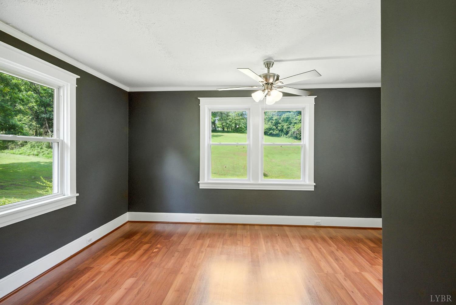 157 Old Country Road Monroe, VA 24574 - Photo 11 of 41 a view of an empty room with wooden floor and a window