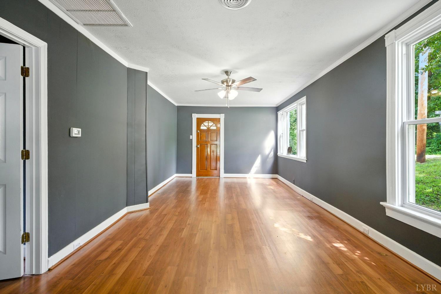 157 Old Country Road Monroe, VA 24574 - Photo 13 of 41 a view of empty room with wooden floor and fan