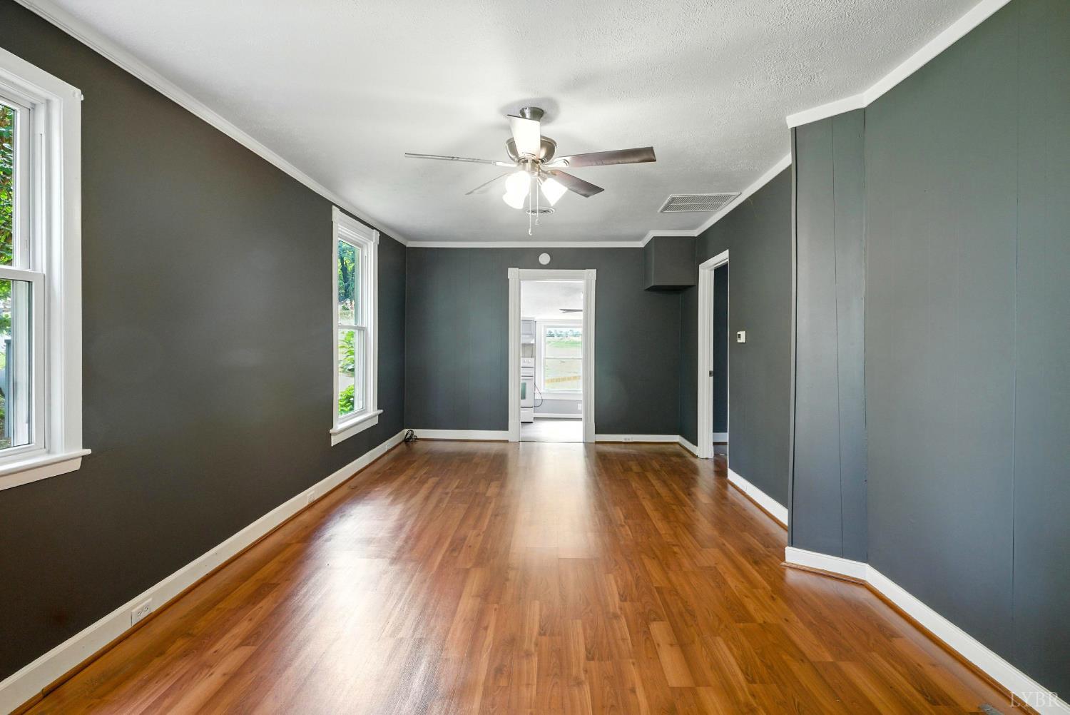 157 Old Country Road Monroe, VA 24574 - Photo 14 of 41 a view of an empty room with wooden floor and a window