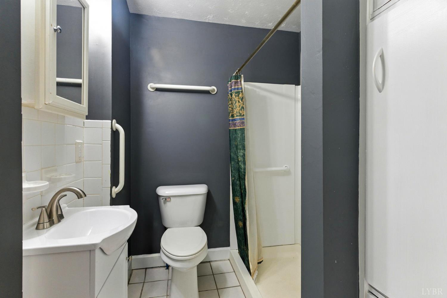 157 Old Country Road Monroe, VA 24574 - Photo 17 of 41 a white toilet sitting next to a bathroom sink