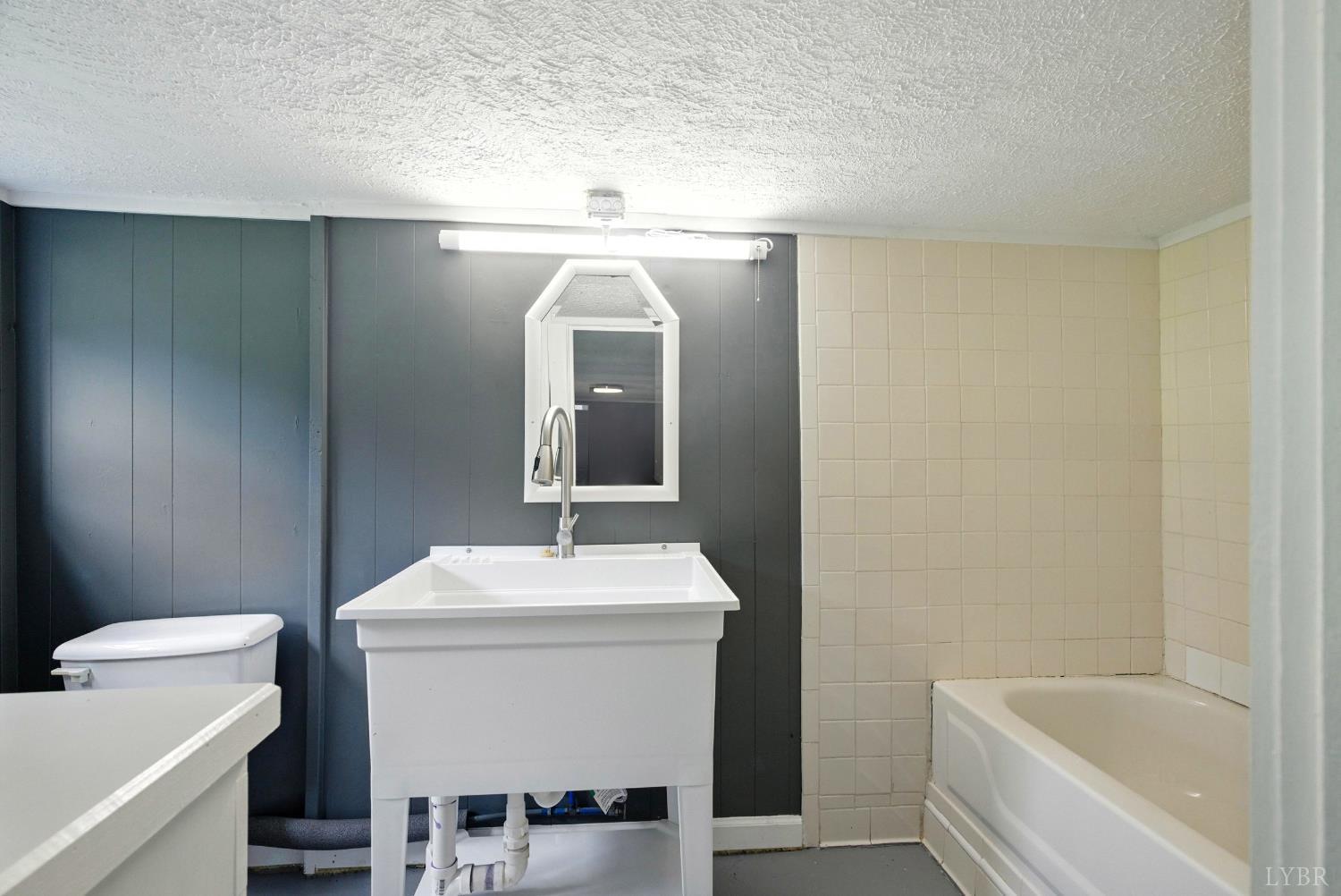 157 Old Country Road Monroe, VA 24574 - Photo 21 of 41 a bathroom with a sink and a mirror