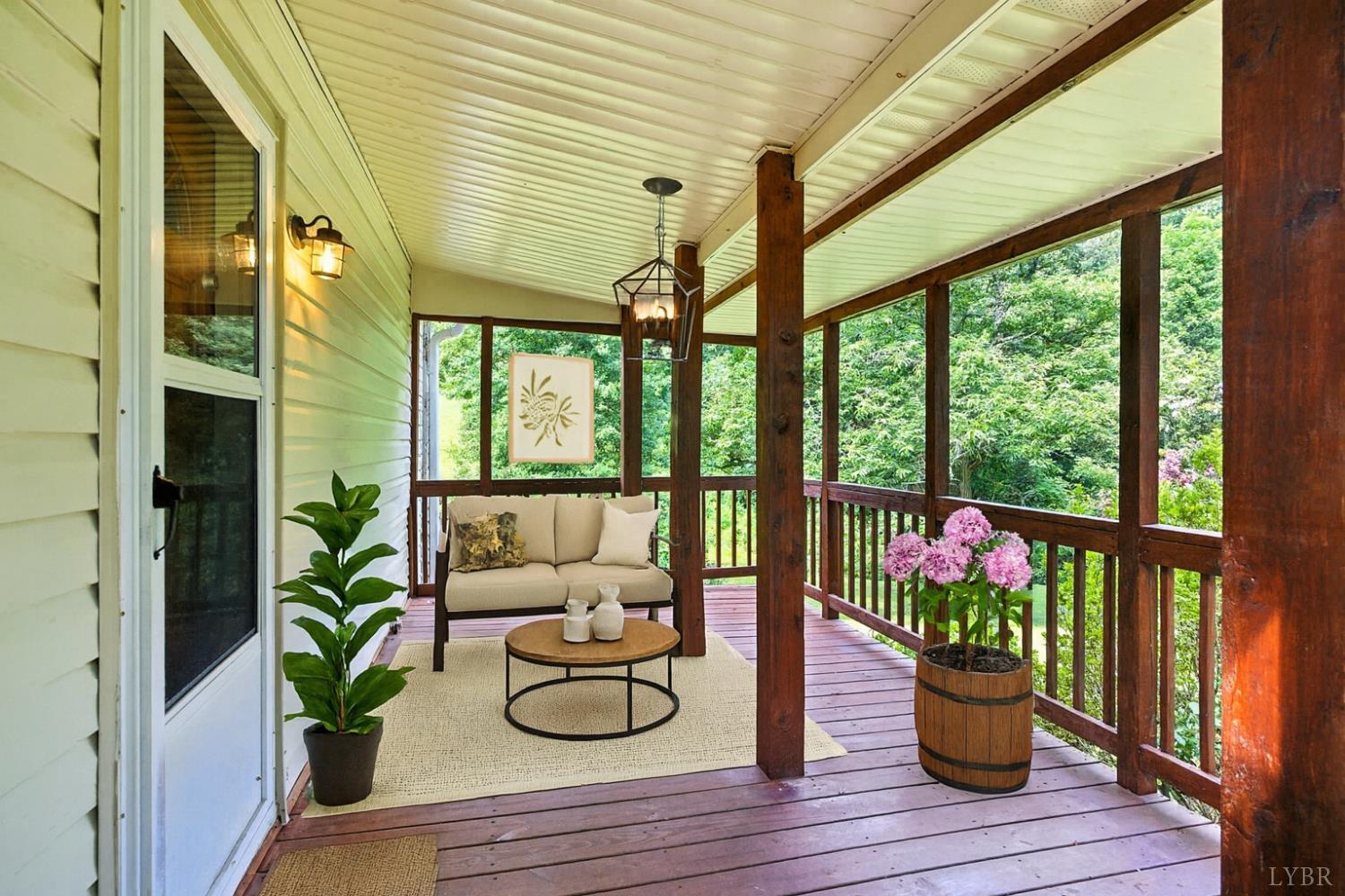 157 Old Country Road Monroe, VA 24574 - Photo 23 of 41 a living room filled with furniture and a potted plant