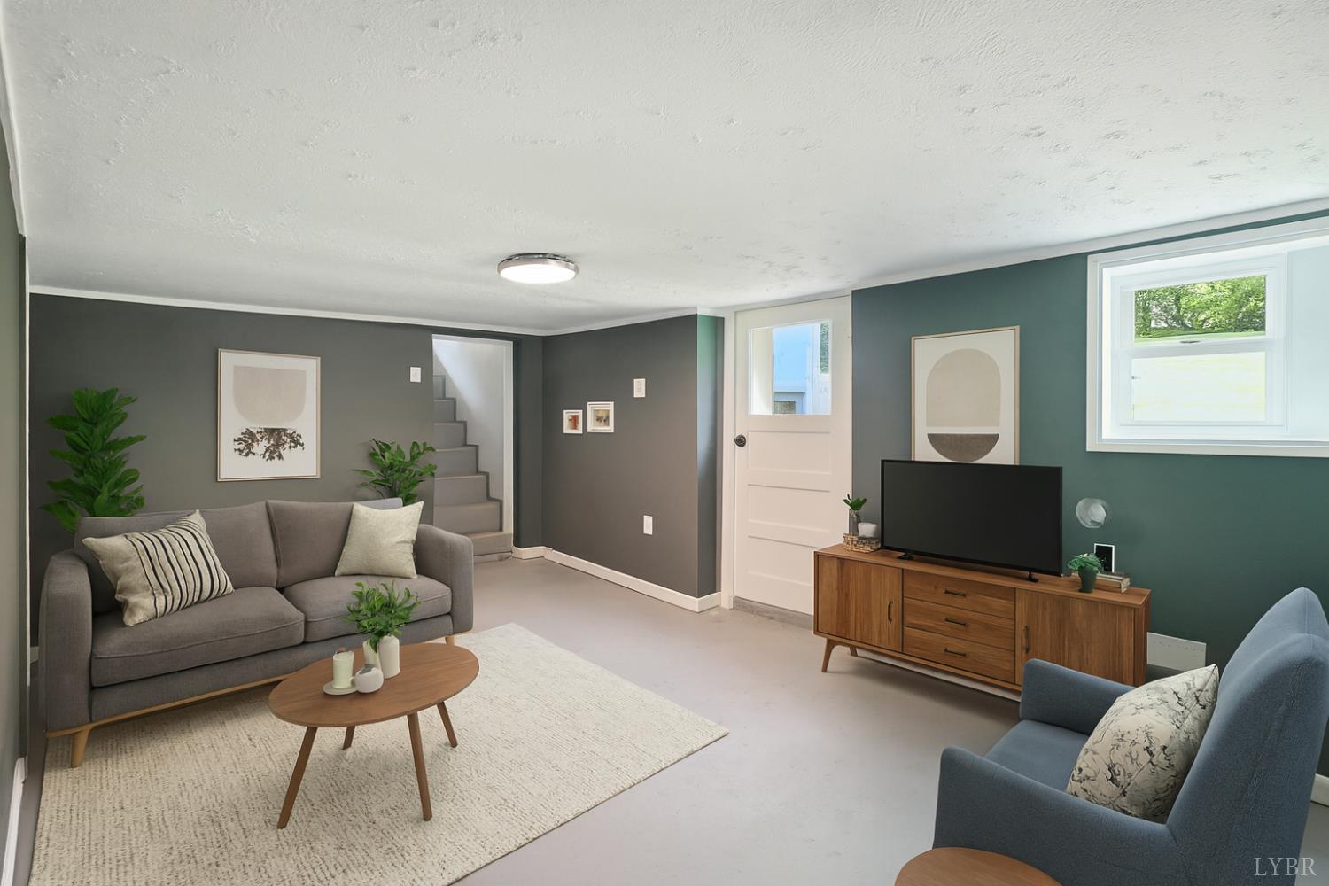 157 Old Country Road Monroe, VA 24574 - Photo 3 of 41 a living room with furniture and a flat screen tv