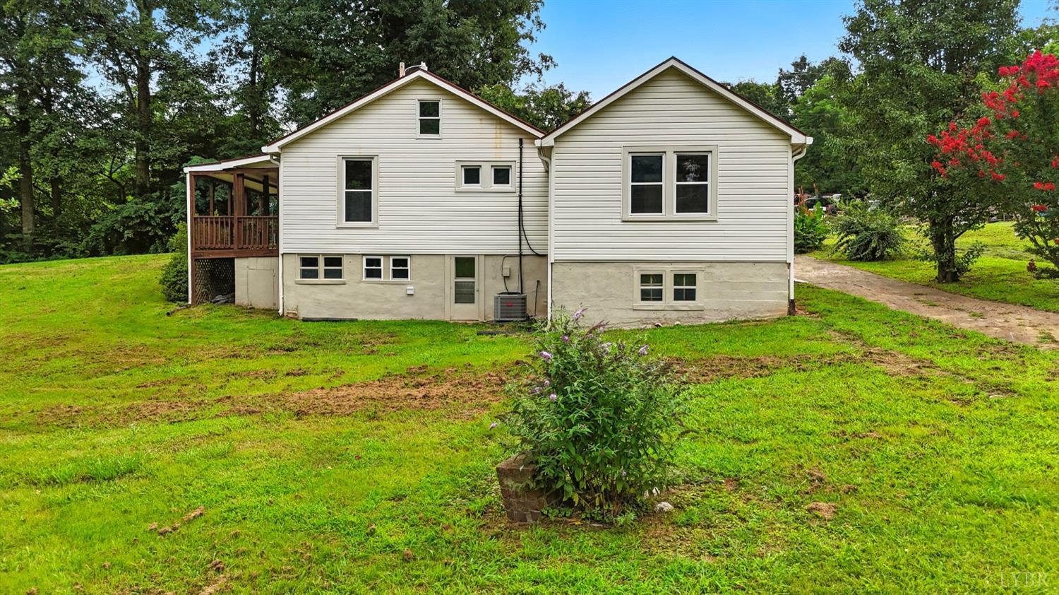 157 Old Country Road Monroe, VA 24574 - Photo 32 of 41 a view of a house with a yard and large trees