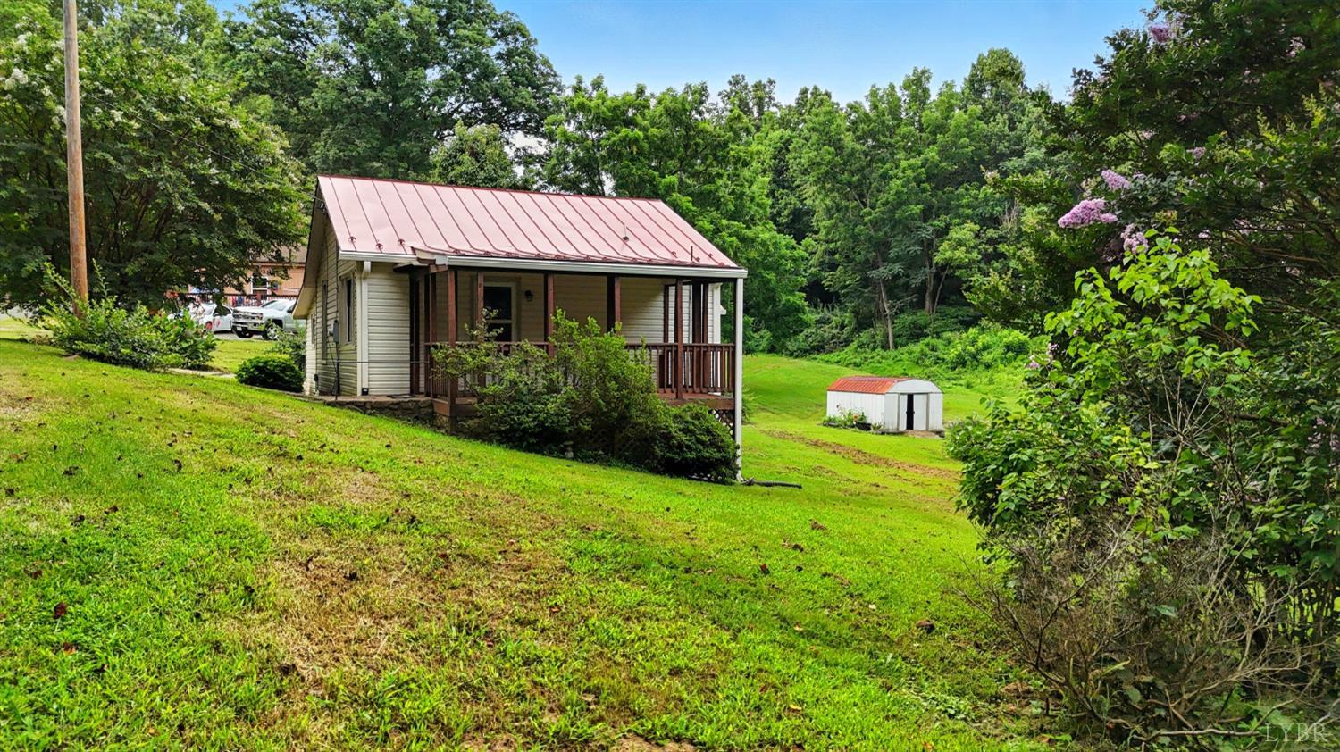 157 Old Country Road Monroe, VA 24574 - Photo 34 of 41 a view of a house with a yard potted plants and a tree